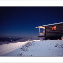 W00169:  Mountain cabin at night with porch light on, NC-TN stat